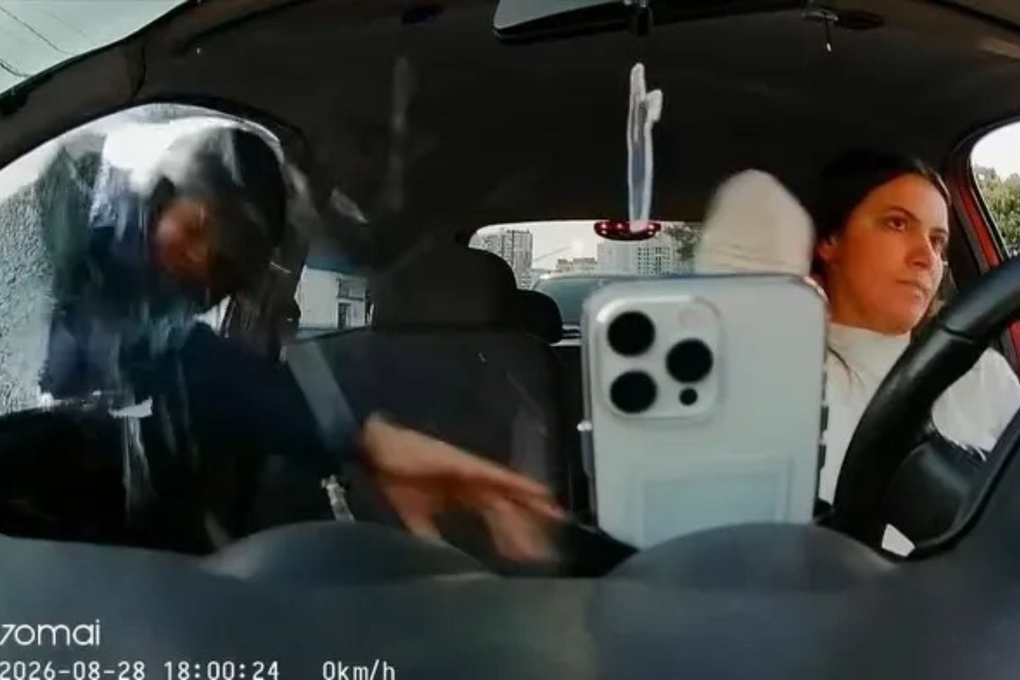 Horrifying moment masked thieves smash influencer’s car window & steal phone in split-second traffic jam attack