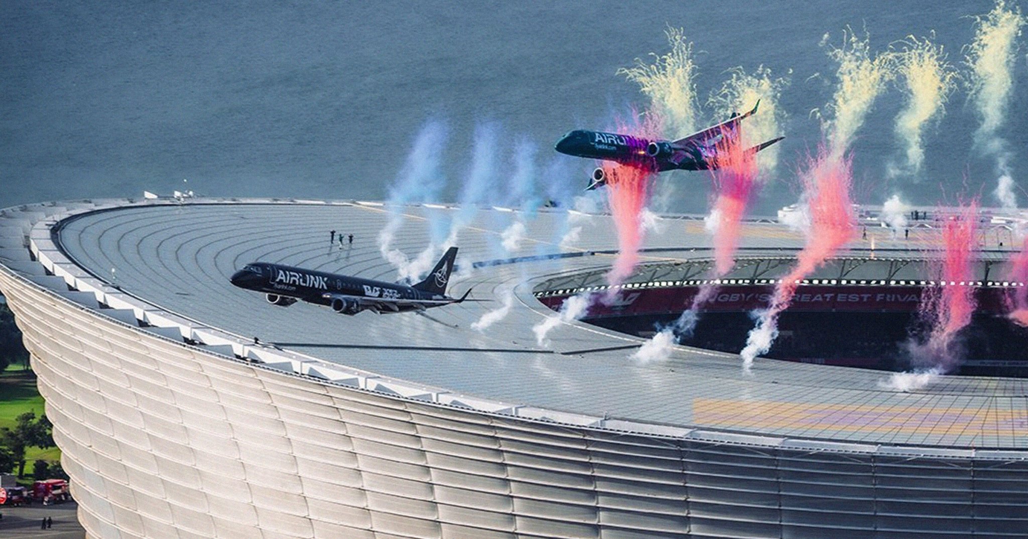 Airline Defends Decision to Fly Two Full Sized Passenger Jets So Close to a Packed Stadium That They Nearly Grazed the Roof