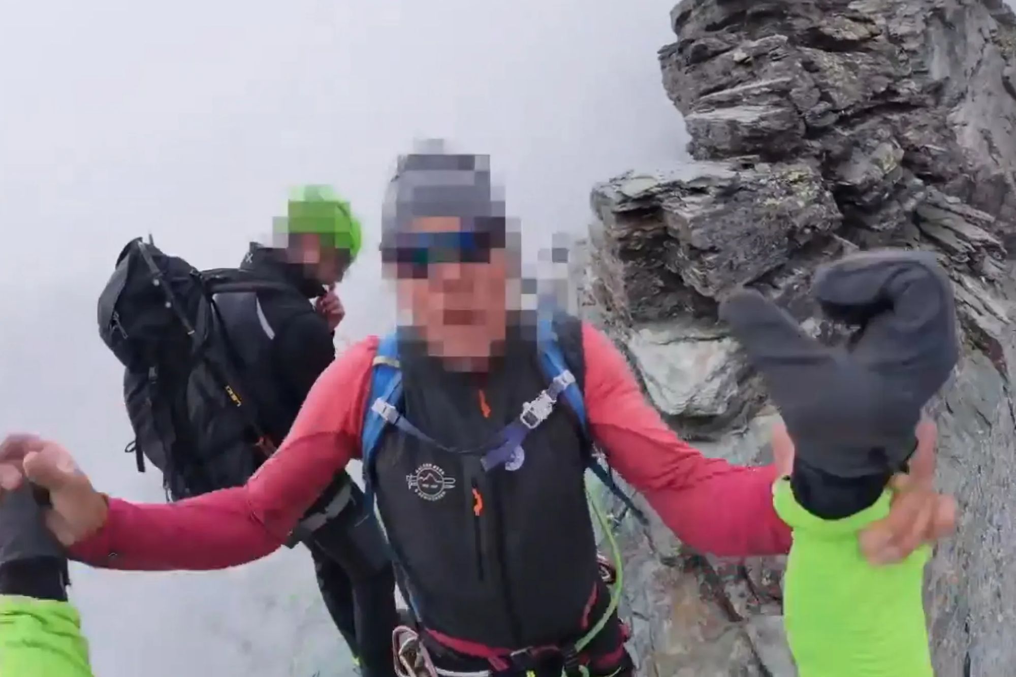 Shocking moment mountain guide attacks climber on tiny ledge at 10,000ft after confronting him for barging past wife
