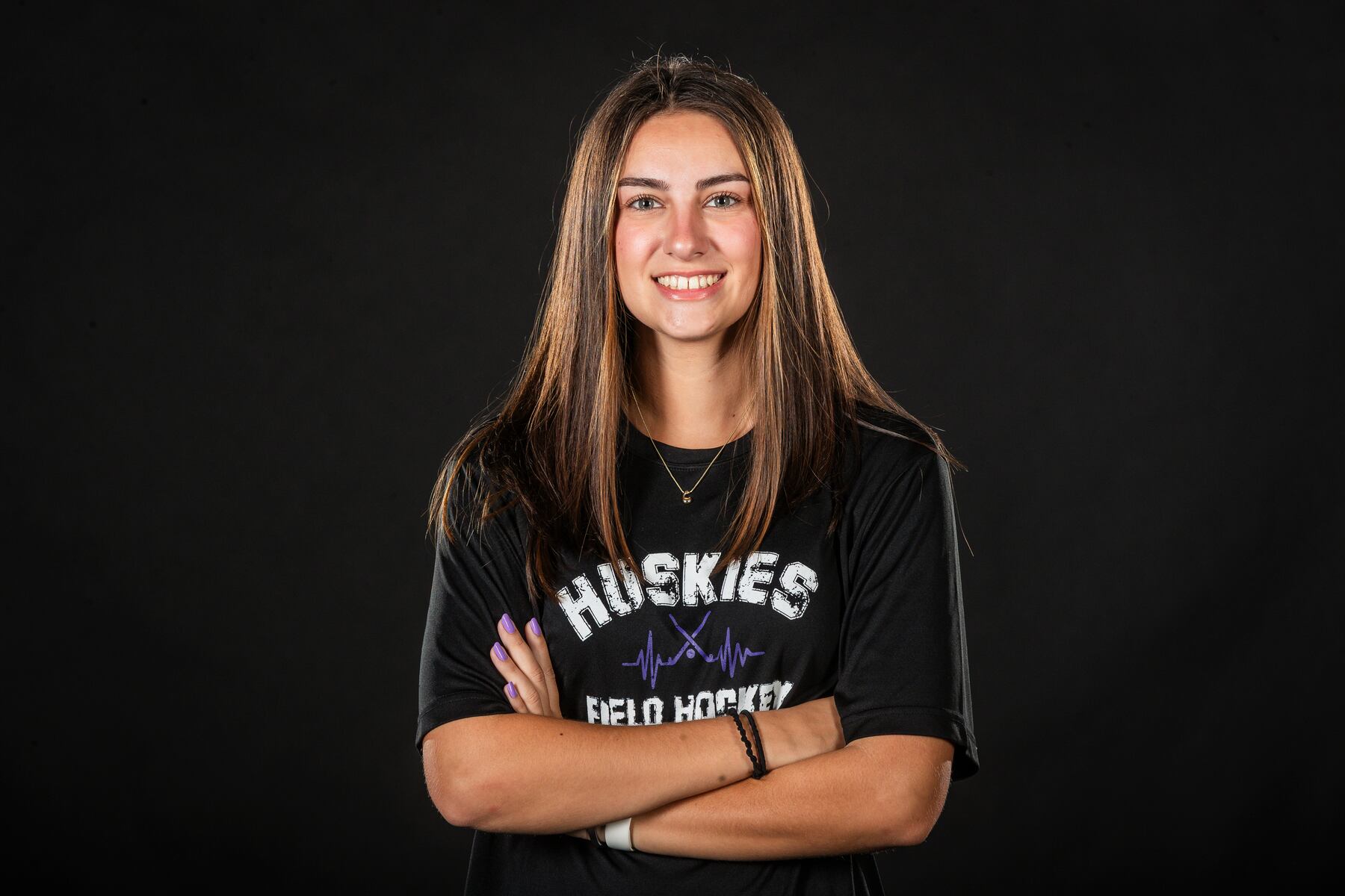 Coletta Beeler focusing on the details in Mifflin County field hockey reunion