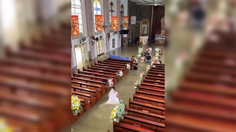 WATCH: Bride walks down flooded church aisle on wedding day