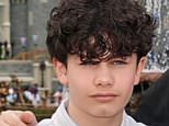 Man and woman charged over death of boy, 12, 'murdered by 15-year-old who mowed him down in car and then punched and kicked him on floor after he was caught on private property'