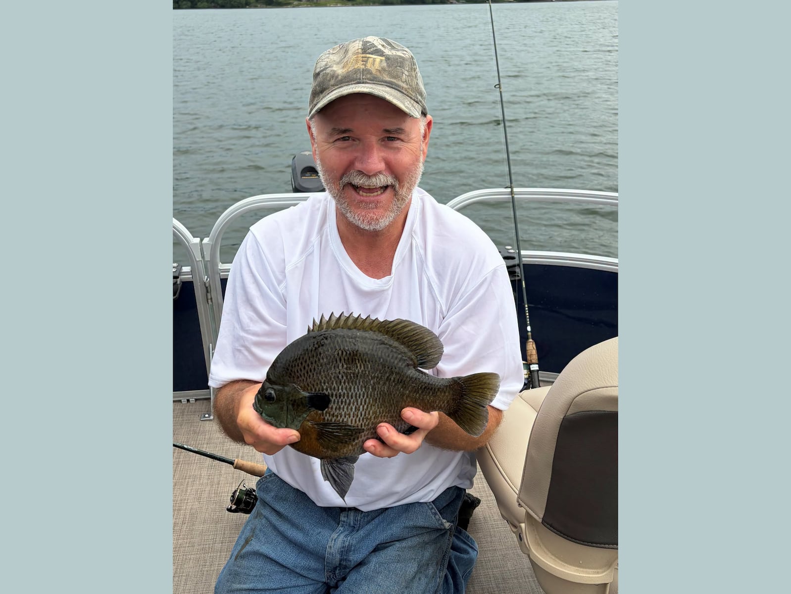 Retiree turns slow fishing trip around, catches ‘bull of a bluegill’ to set state record