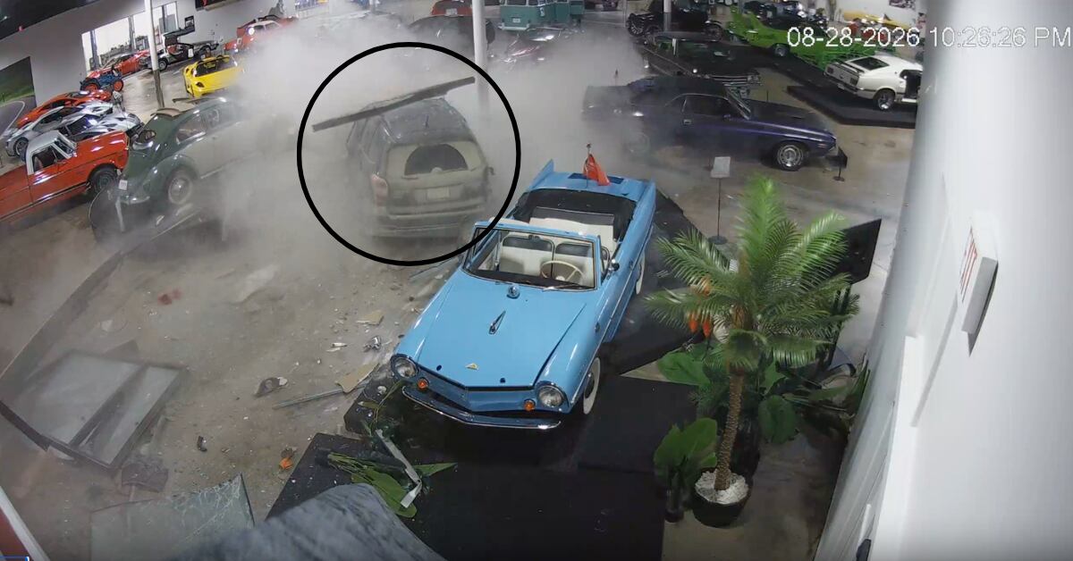 Watch as a vehicle slams into a classic car collection