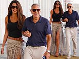 Amal Clooney wows in £1,695 snake print Elie Saab skirt as she links arms with husband George Clooney as they leave the 83rd Venice Film Festival