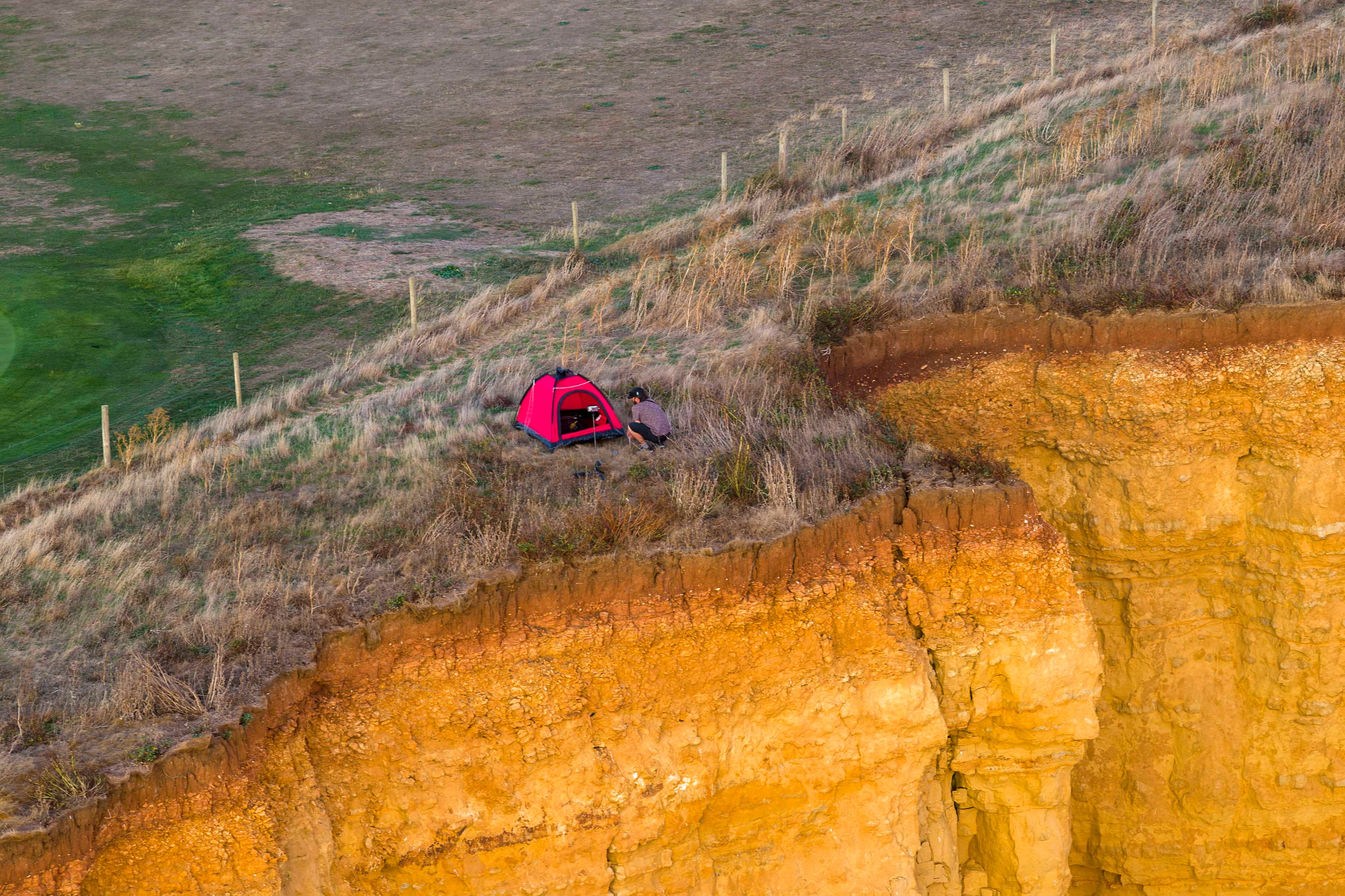 ‘Idiot’ camper pitches tent on edge of crumbling 150ft cliff at beauty spot made famous by hit TV show