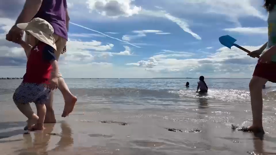 Coney Island beachgoers soaking it in before school starts