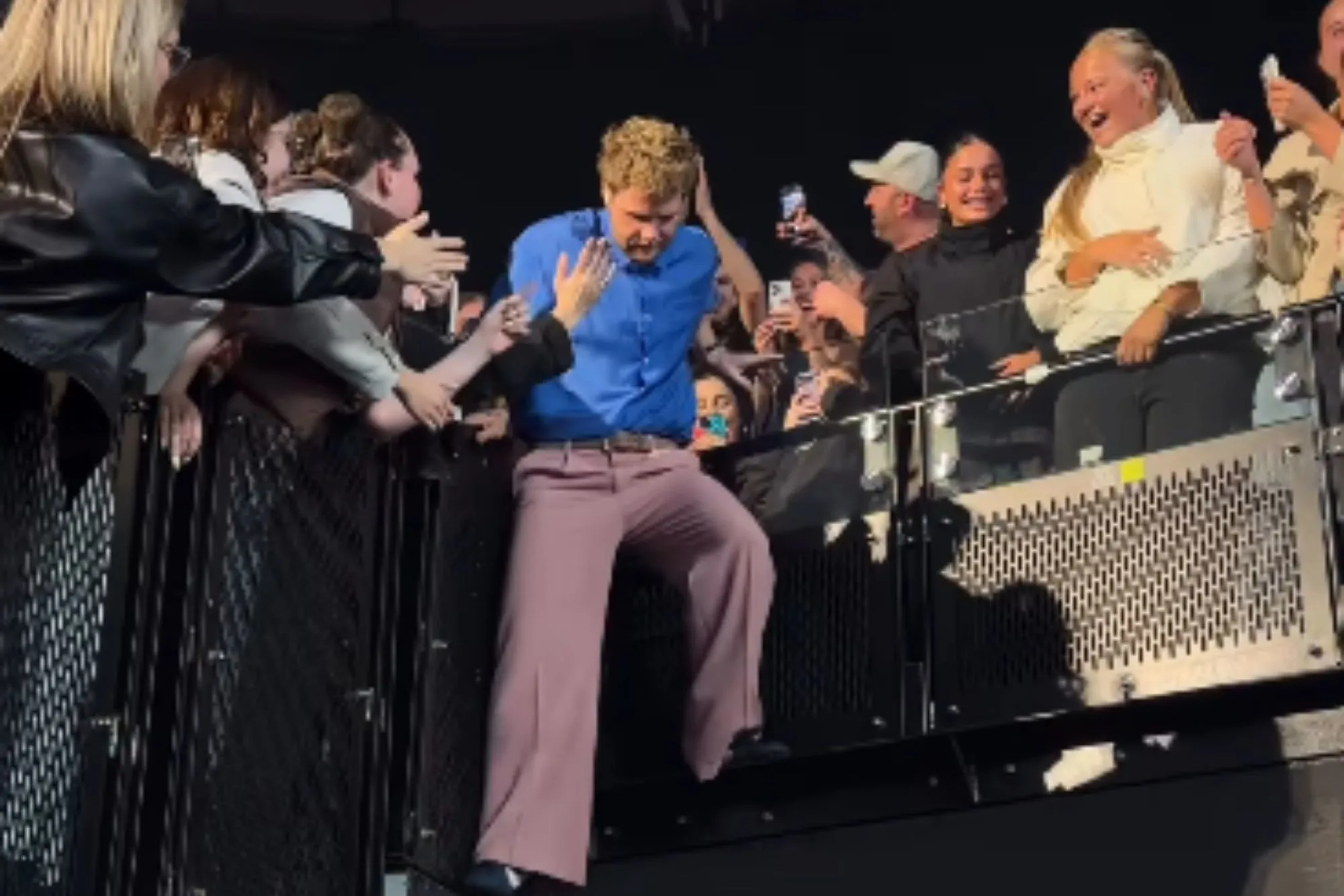 Watch the moment huge pop star suffers nasty fall during concert as fans gasp in shock