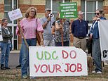 The residents fighting back against traveller land grabs: Villagers descend on council offices to demand eviction from Essex field - days after another site was cleared following protest
