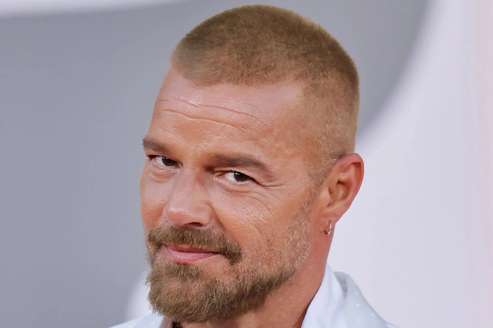 Huge 90s pop star looks unrecognisable as he hits red carpet with buzz cut 27 years after smash hit – can you guess who?