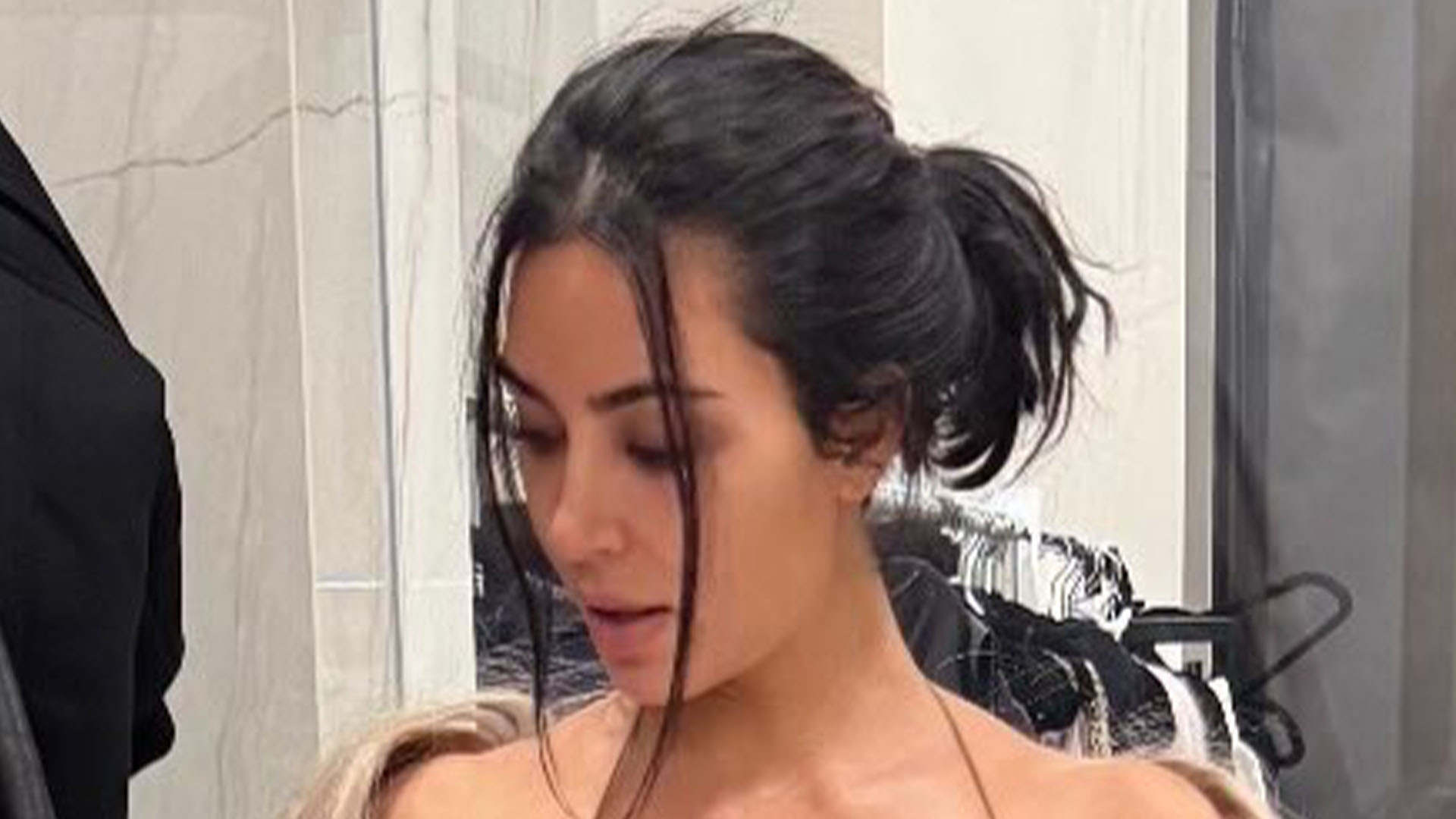 Kim Kardashian ditches her underwear in VERY low-cut backless dress and uses just a black bar to cover her nipples