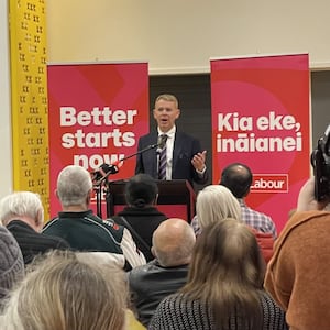 Chris Hipkins holds first public meeting of campaign, meeting supporters and a cat