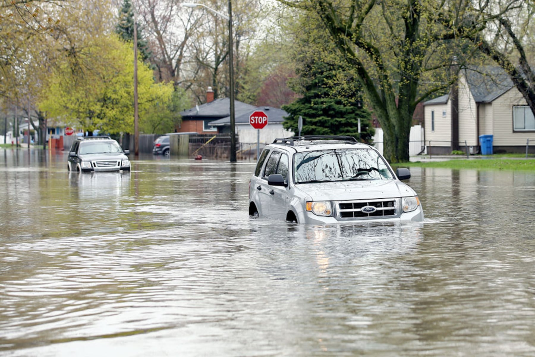Flooded street detour in Michigan sparks viral dispute between homeowner and driver