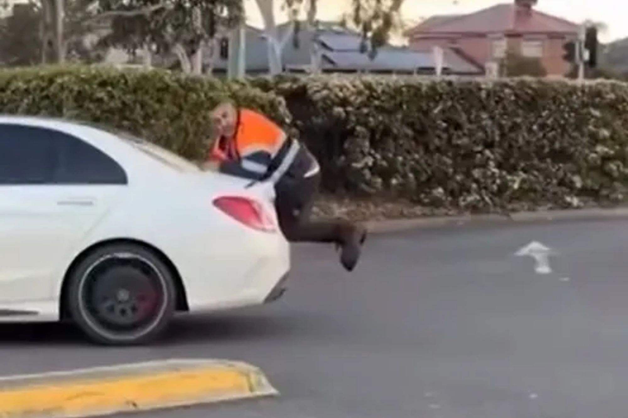 Wild moment car mechanic clings to Mercedes boot as driver reverses in row over ‘unpaid work worth thousands’