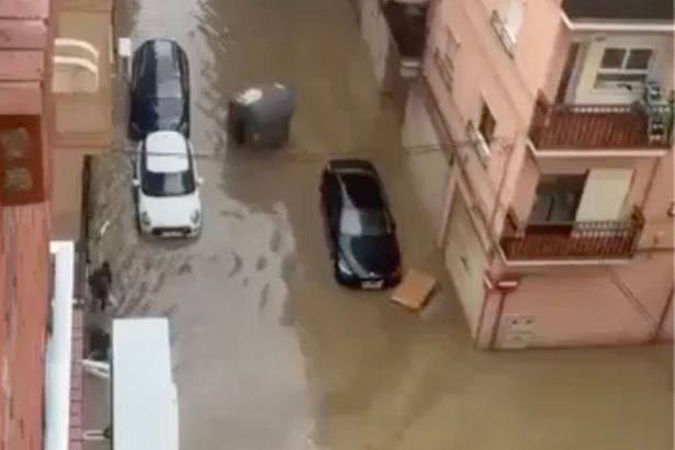 Flash floods in Spanish holiday hotspots kill woman, 67, as torrential rain turns roads into rivers
