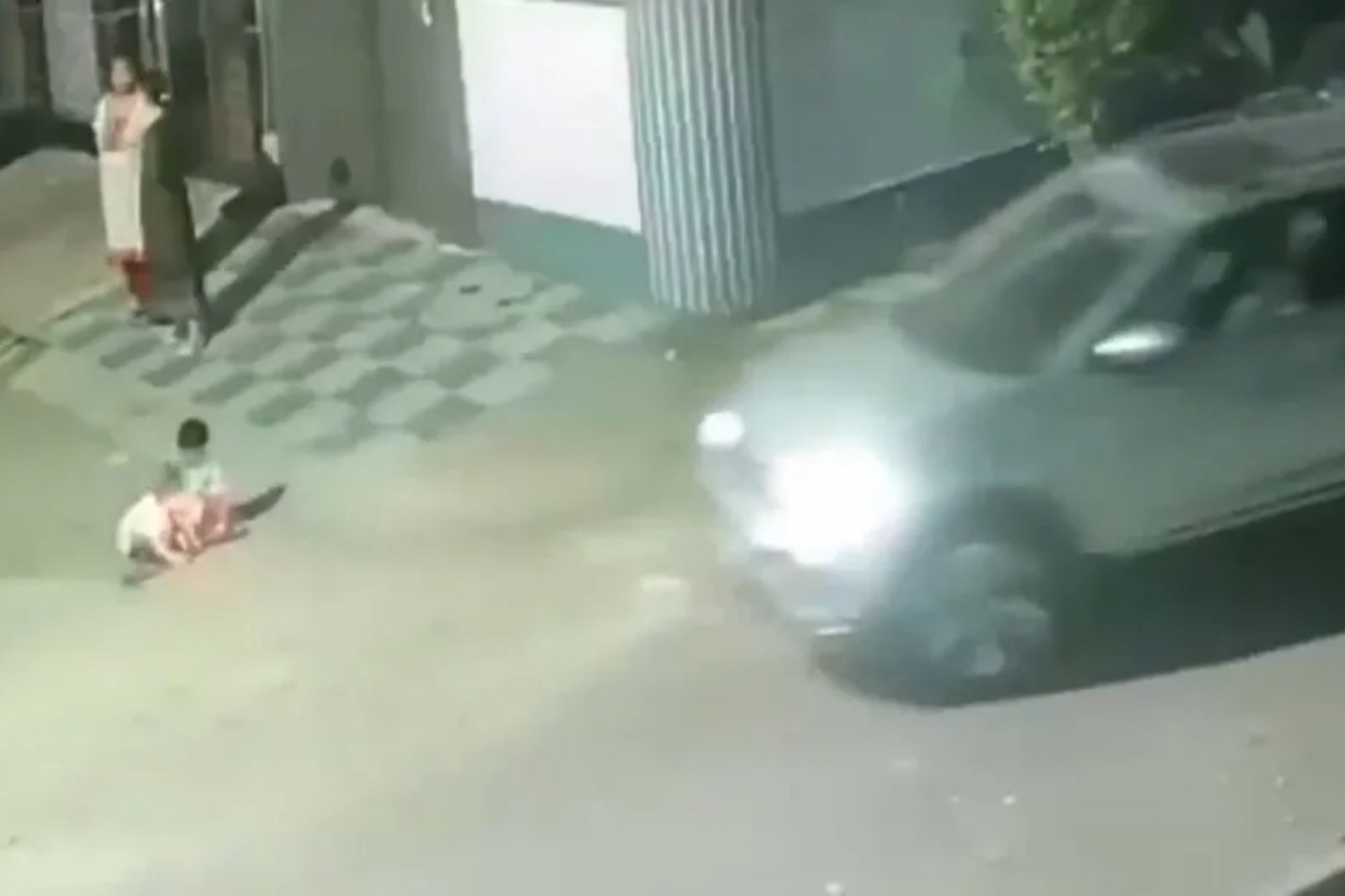Horrifying moment girl, 2, playing with sister is crushed to death by car as mum chatted to pal nearby
