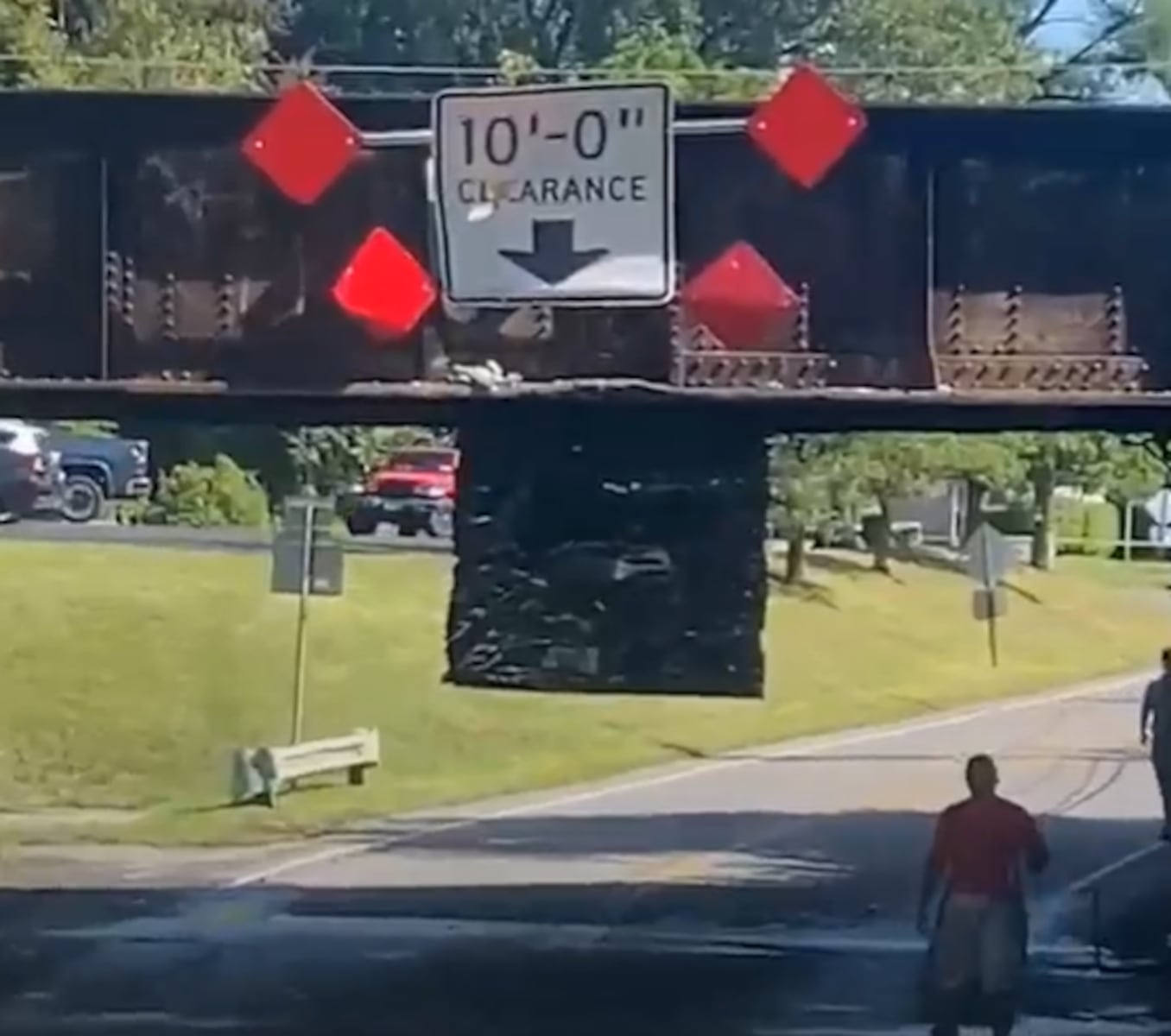 Box truck hits railroad bridge in DeWitt