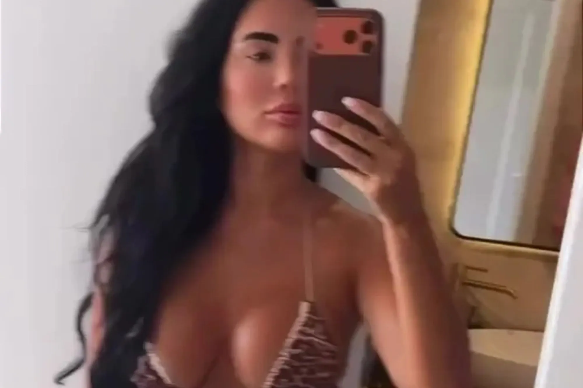Towie’s Yazmin Oukhellou shows off results of surgery spree in tiny leopard print bikini after police raid