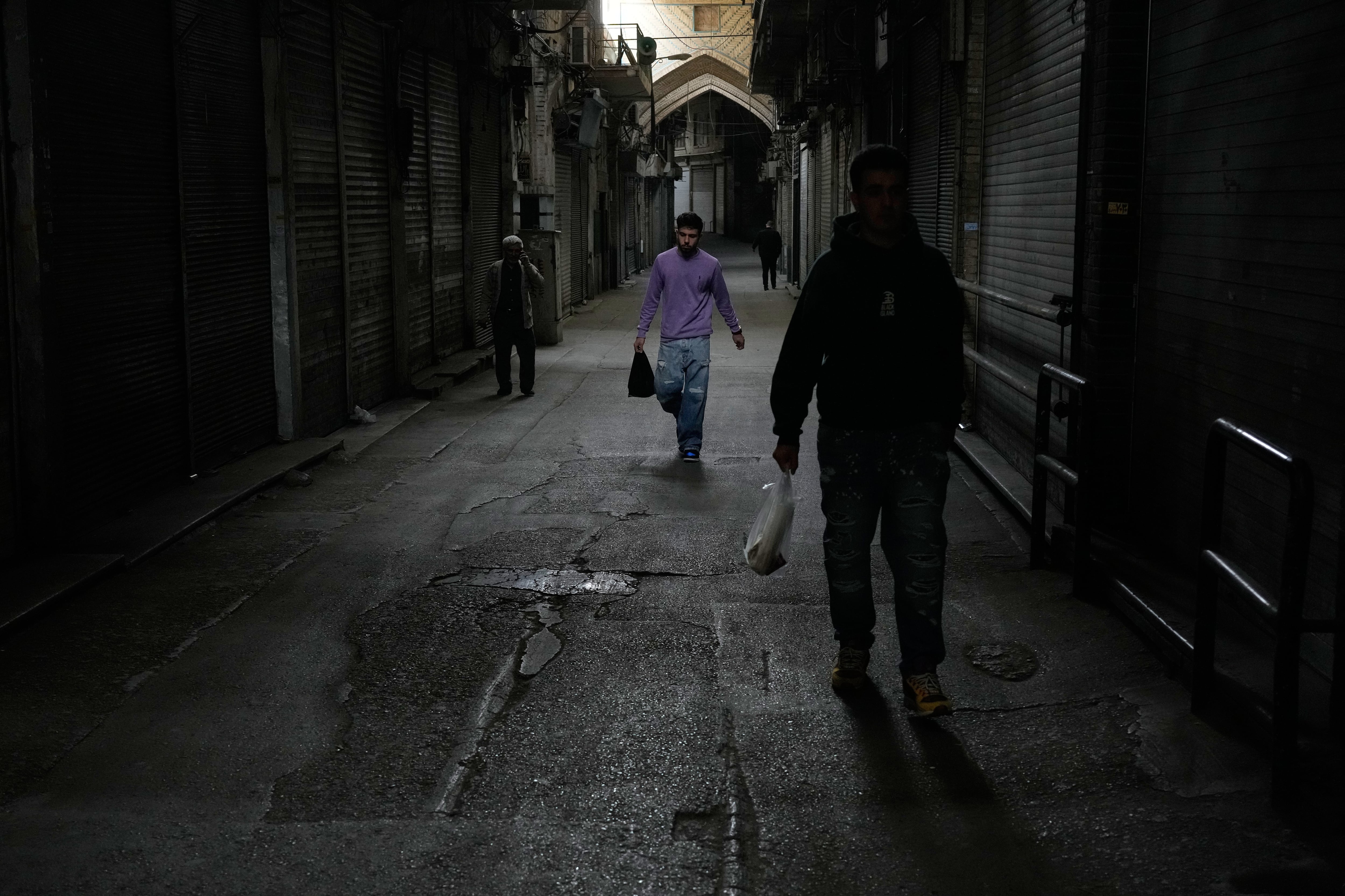 Amid war and sanctions, many Iranians are losing their jobs and struggling to get by
