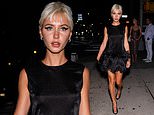 Iris Law parties in a feathered black mini dress after taking over the catwalk with fellow nepo baby Lila Moss during NY Fashion Week