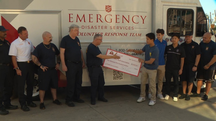 Students present donation for Dallas first responders