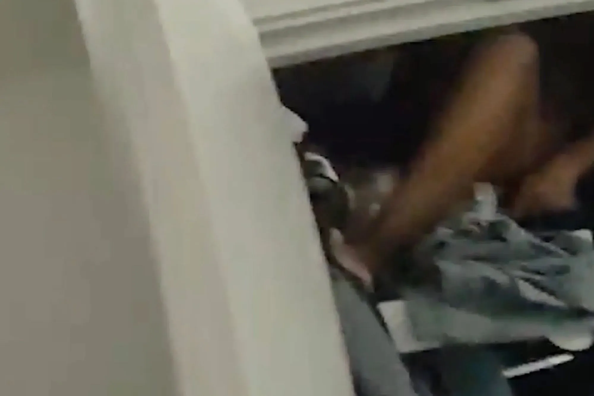 Moment half-naked drug dealer is caught hiding in wardrobe & arrested after exposing location on public Wi-Fi