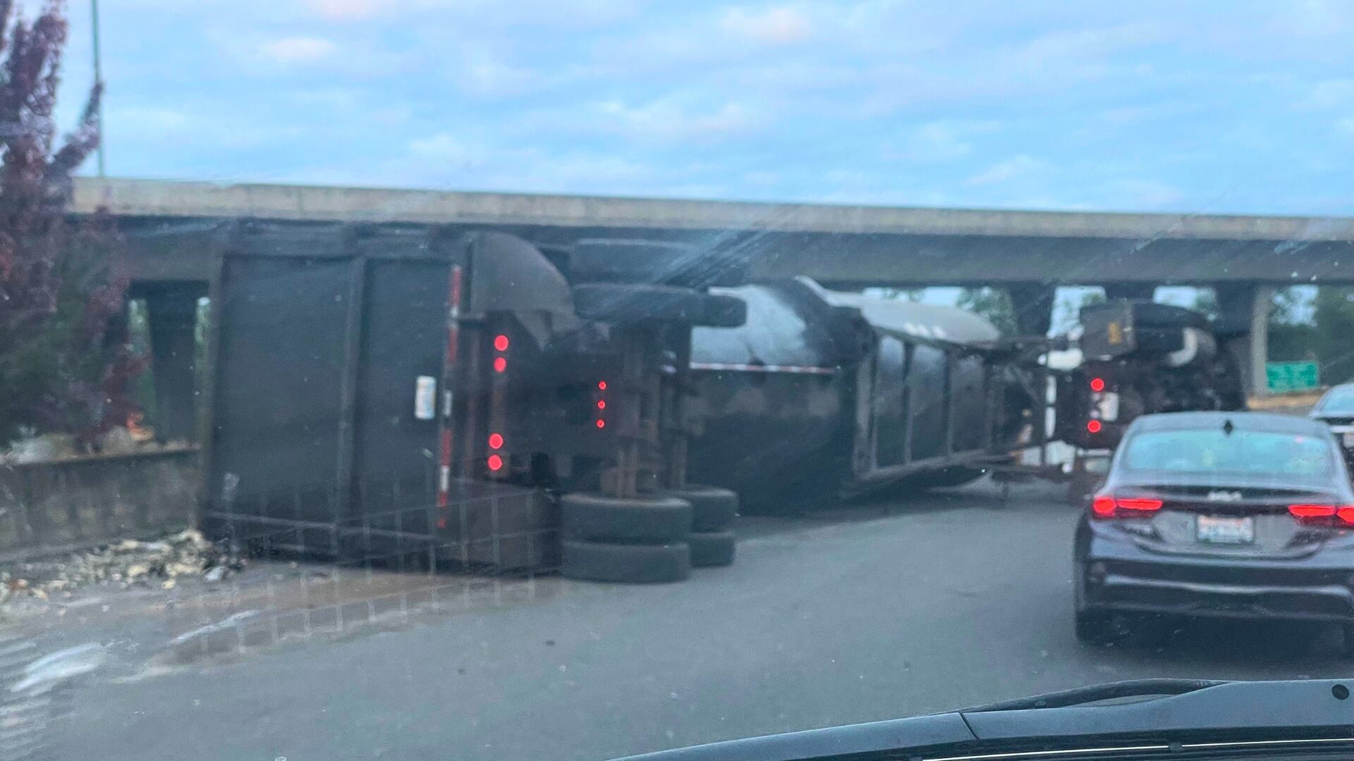 Semi rollover spills metal, shuts down I-5 ramp in Portland
