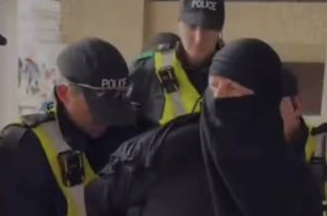 Man charged in UK after wearing burqa at anti-migrant protest