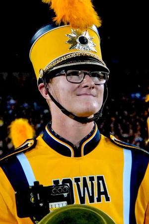 Nebraska band dons black and gold to honor late Iowa student at halftime