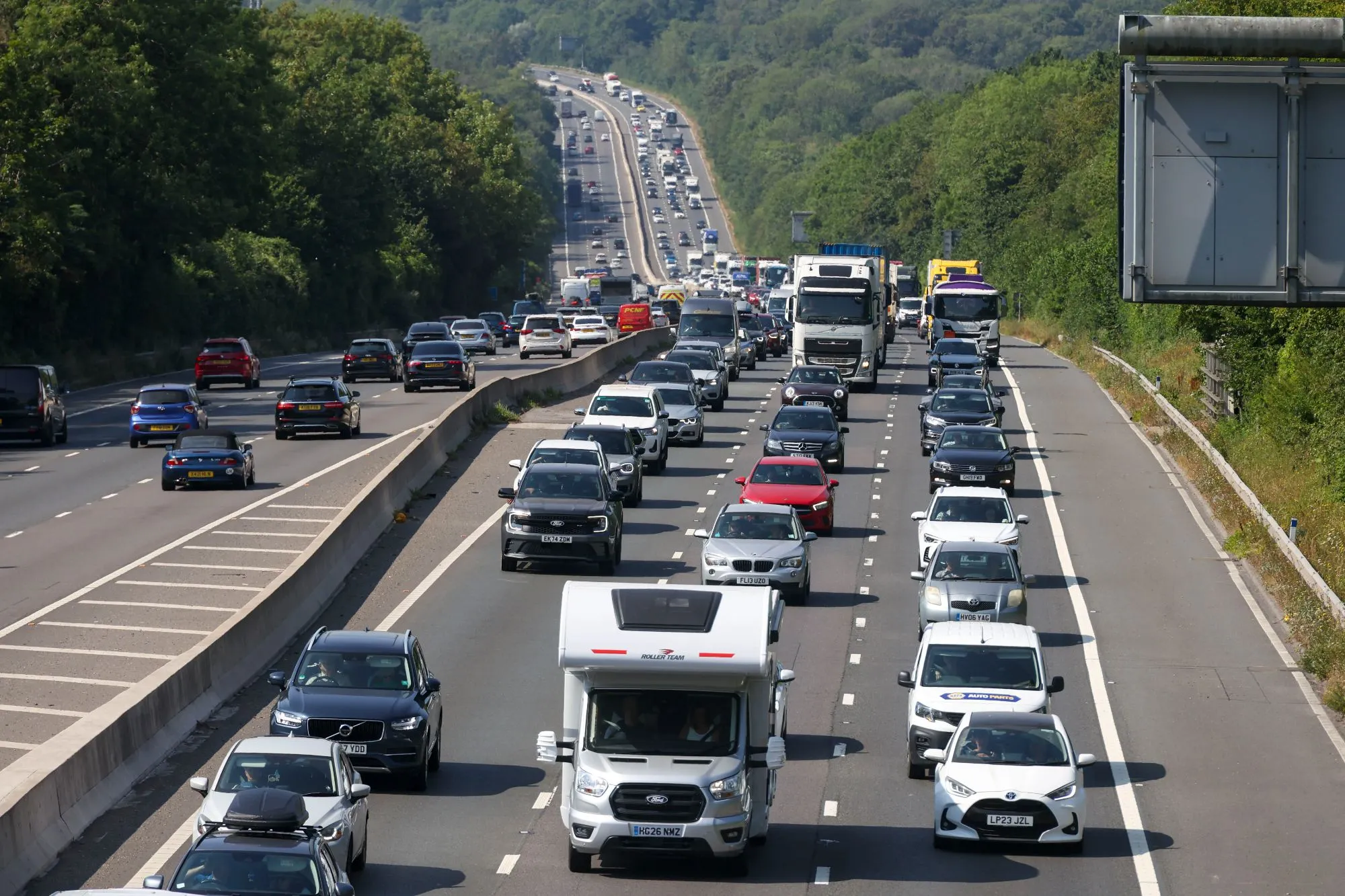 M3 closed after lorry ploughs into central reservation & spills 300 litres of diesel – as road to remain shut for hours