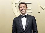 Apple's new CEO John Ternus shows off the iPhone Duo on the Emmys red carpet - as delighted fans call him the 'coolest person in the room'