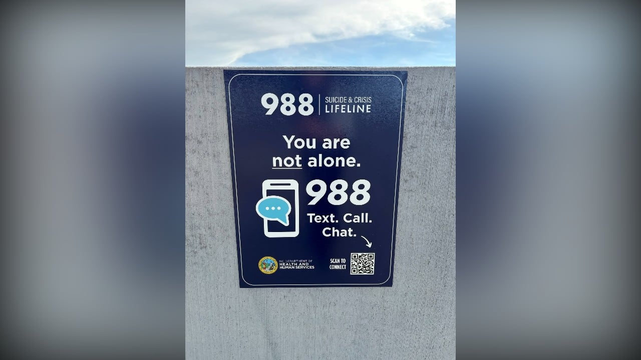 State installs 988 crisis hotline signs in parking decks