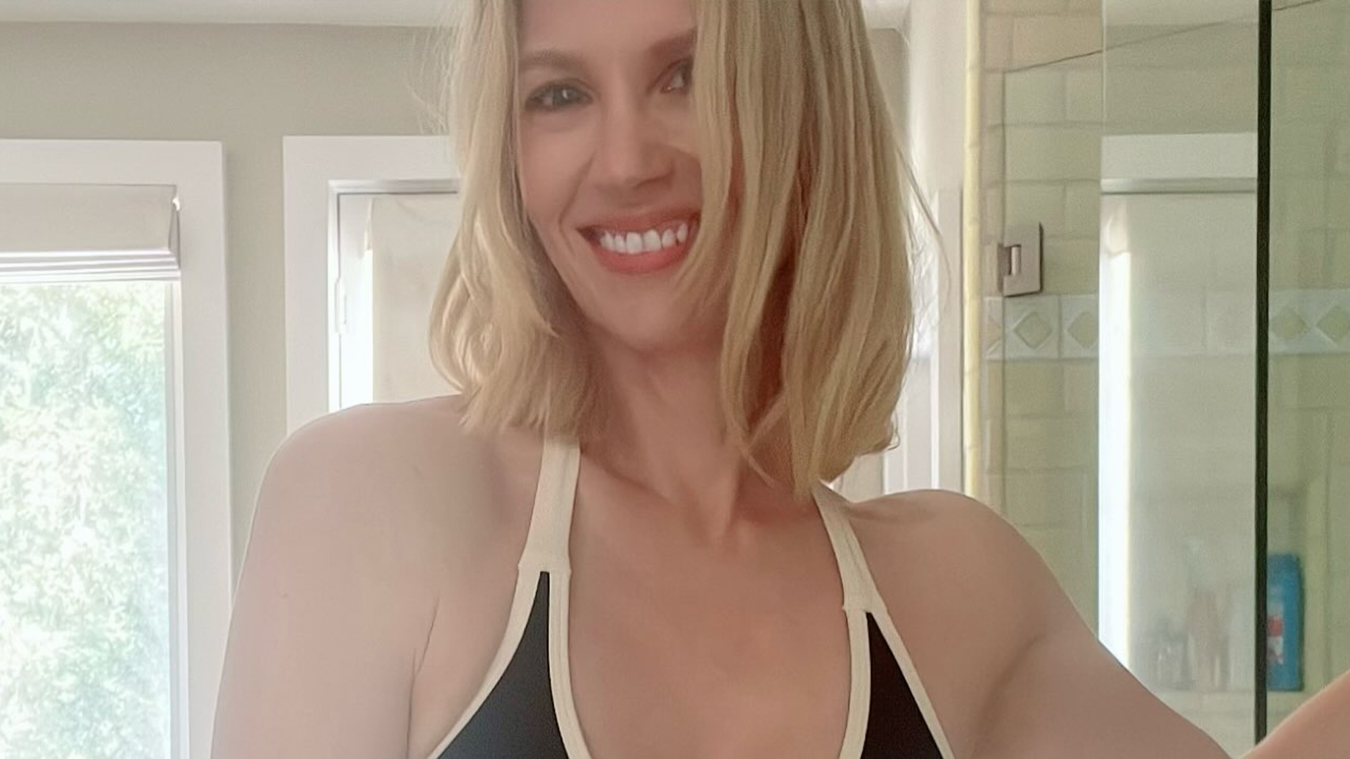 Mad Men beauty January Jones, 48, looks half her age in a tiny bikini for bathroom selfie
