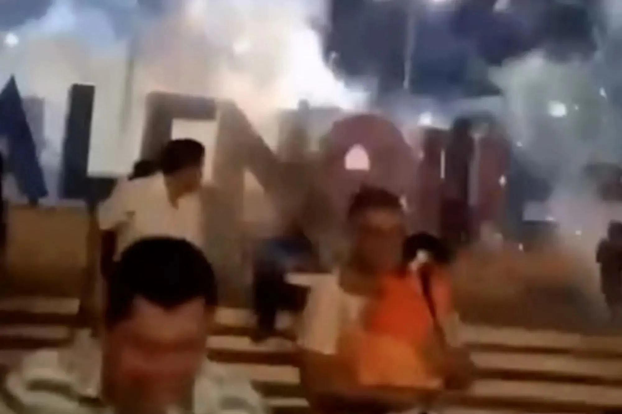 Terrifying moment fireworks shoot into crowd as families grab children & run for their lives with at least 4 injured
