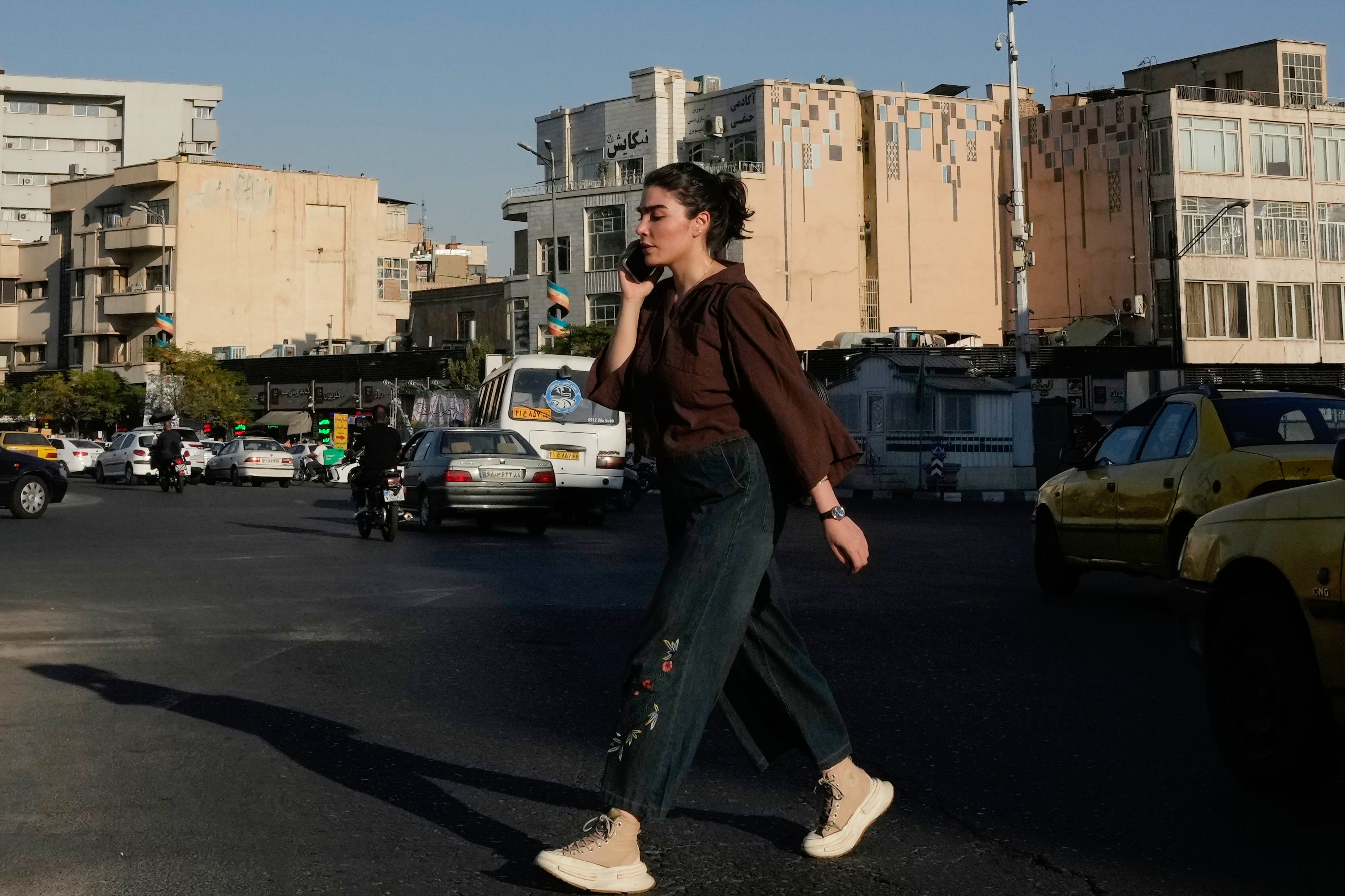 Iran hesitates to clamp down on defiance of headscarf rules as war and economic pressures mount