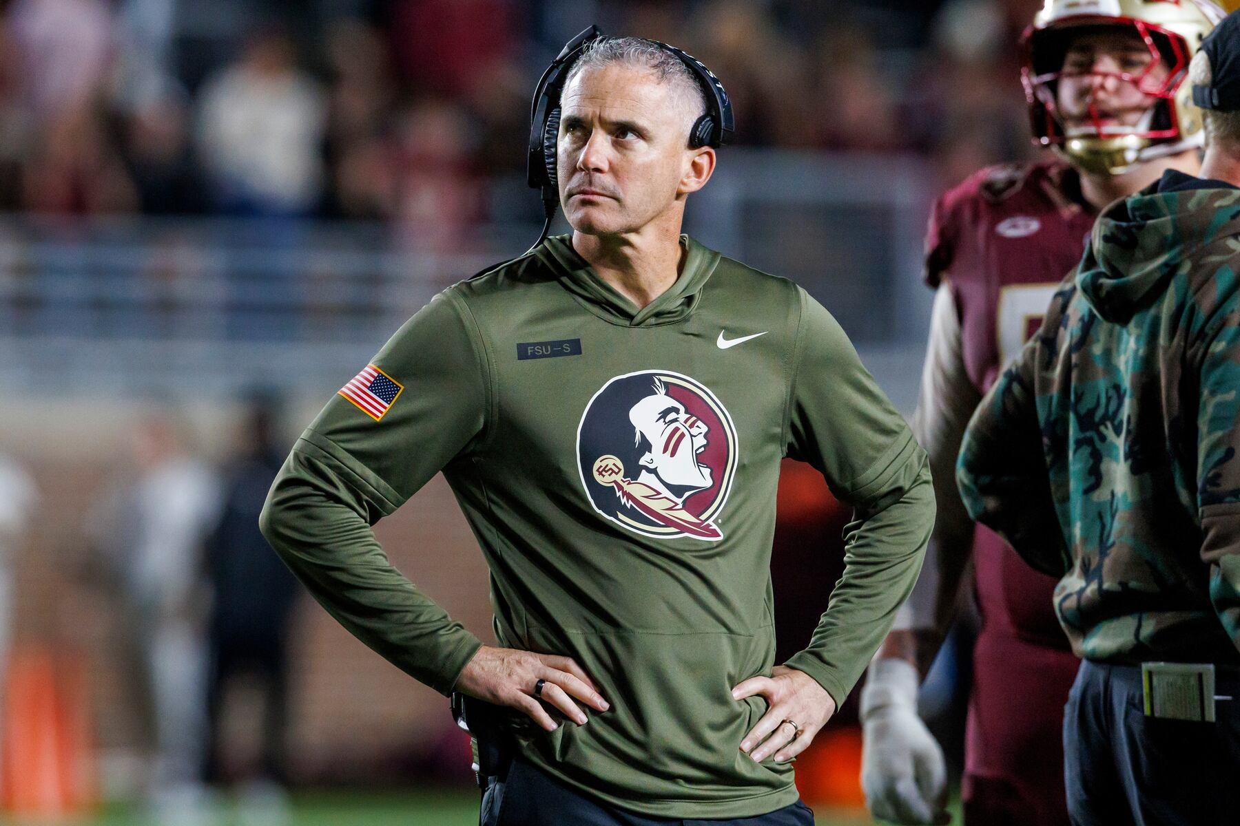 Prominent college football coach questioned about moving truck being outside his house