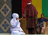 Lovers are flogged 100 times each for adultery with girlfriend begging for mercy then collapsing in pain during brutal Sharia caning in Indonesia
