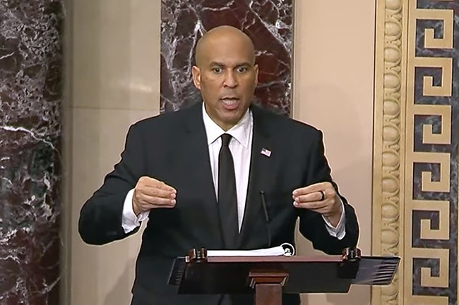 The Hilarious Progression of Cory Booker and the 'Michigan Fist'