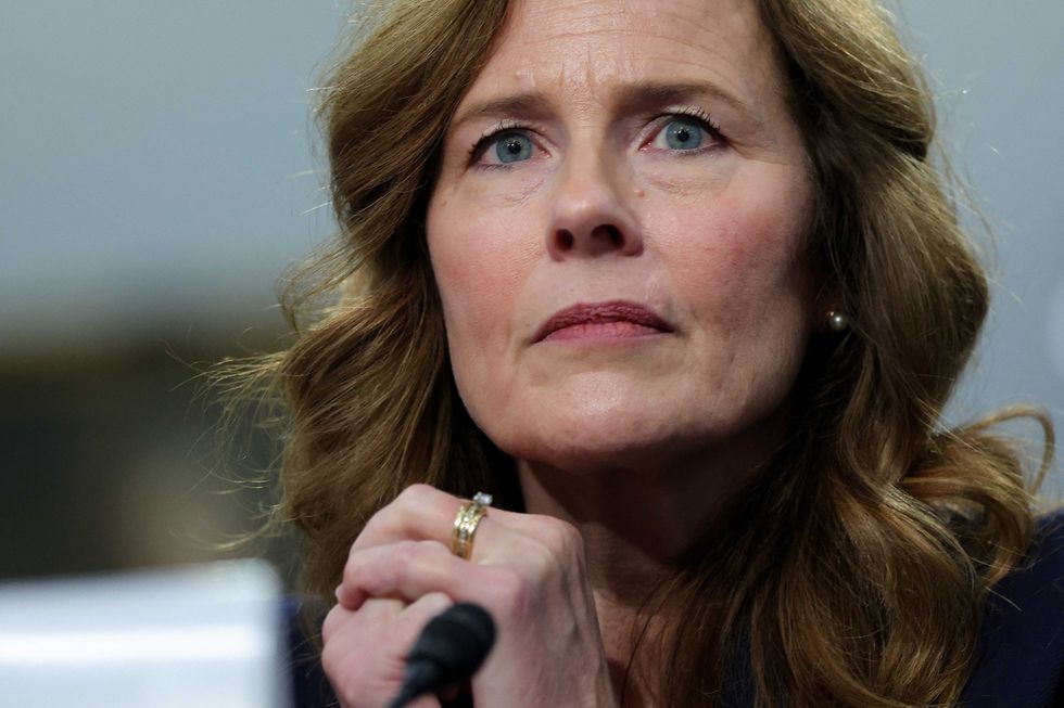 Amy Coney Barrett deflects question about Trump threatening justices