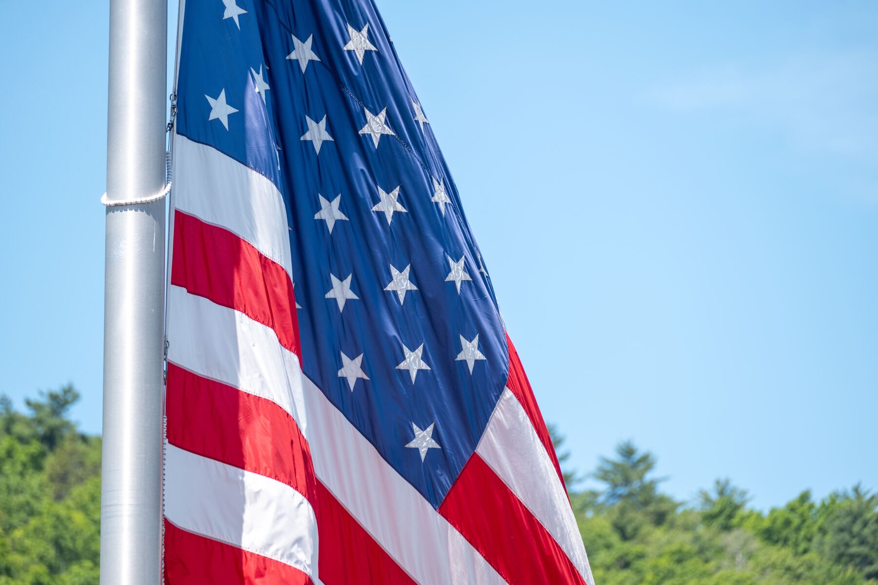 Why are flags in Mass. flying at half-staff?