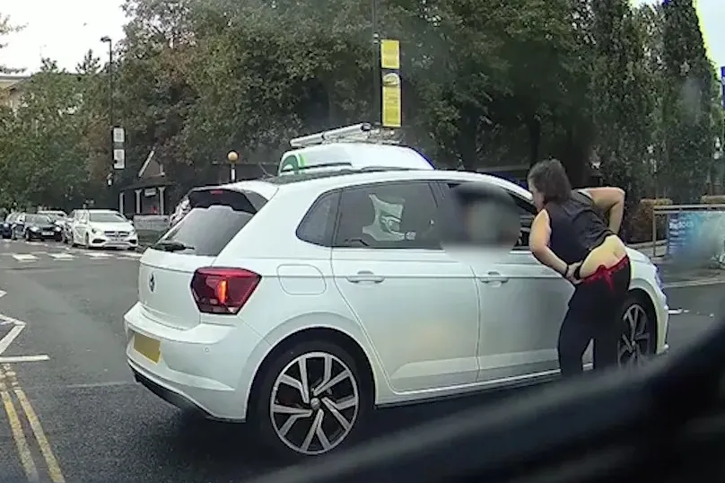 Disgusting moment road rage woman lurches back & ‘SPITS’ at another driver in fierce row over road being blocked