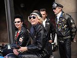 Va-va-vroom! Vintage fanatics don fabulous furs, polka-dot dresses and leather jackets as they turn back the fashion clock for a day of motor racing at Goodwood Revival
