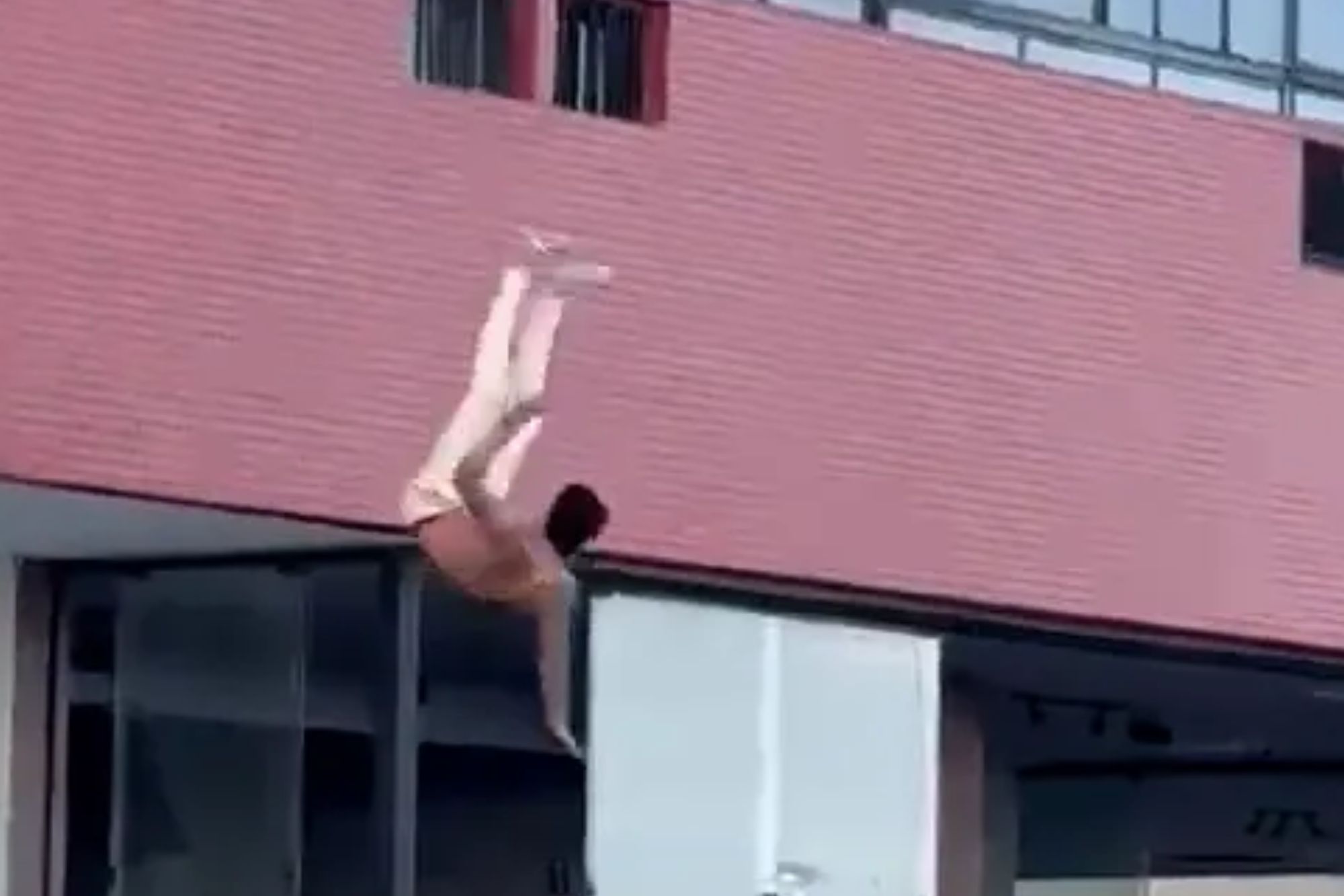 Shocking moment man plunges from hotel window as he tries to escape after ‘being caught with another man’s wife’