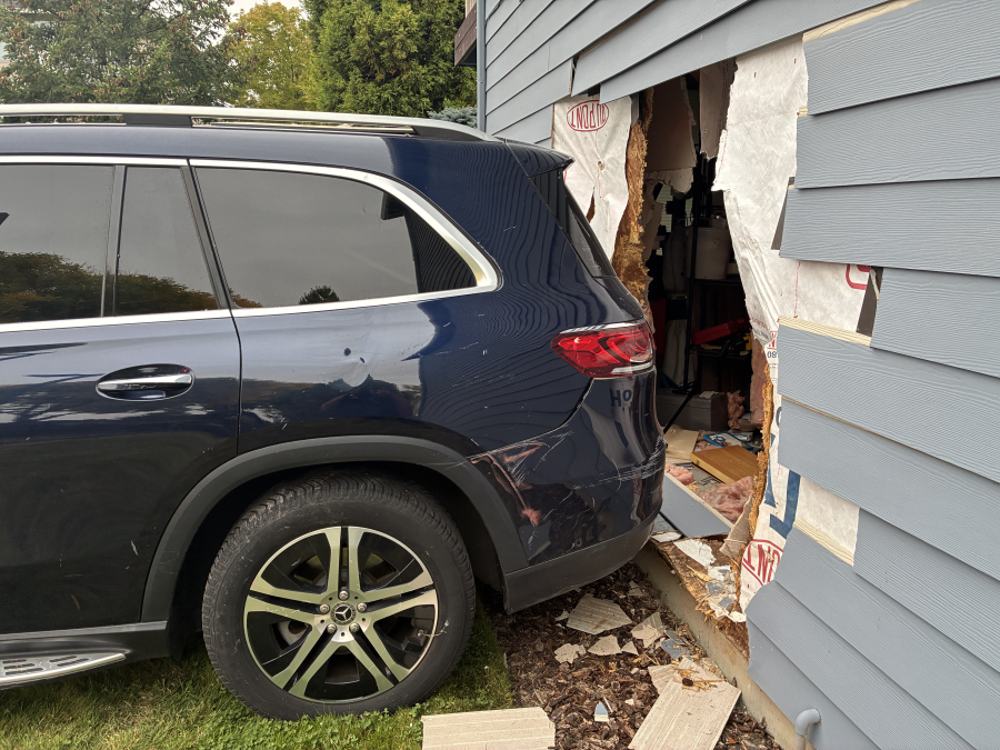 PHOTOS: Car leaves hole in home after Camas crash