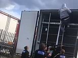 Moment seven migrants are found hiding in back of a lorry as people traffickers turn away from small boats in favour of HGVs to get into UK