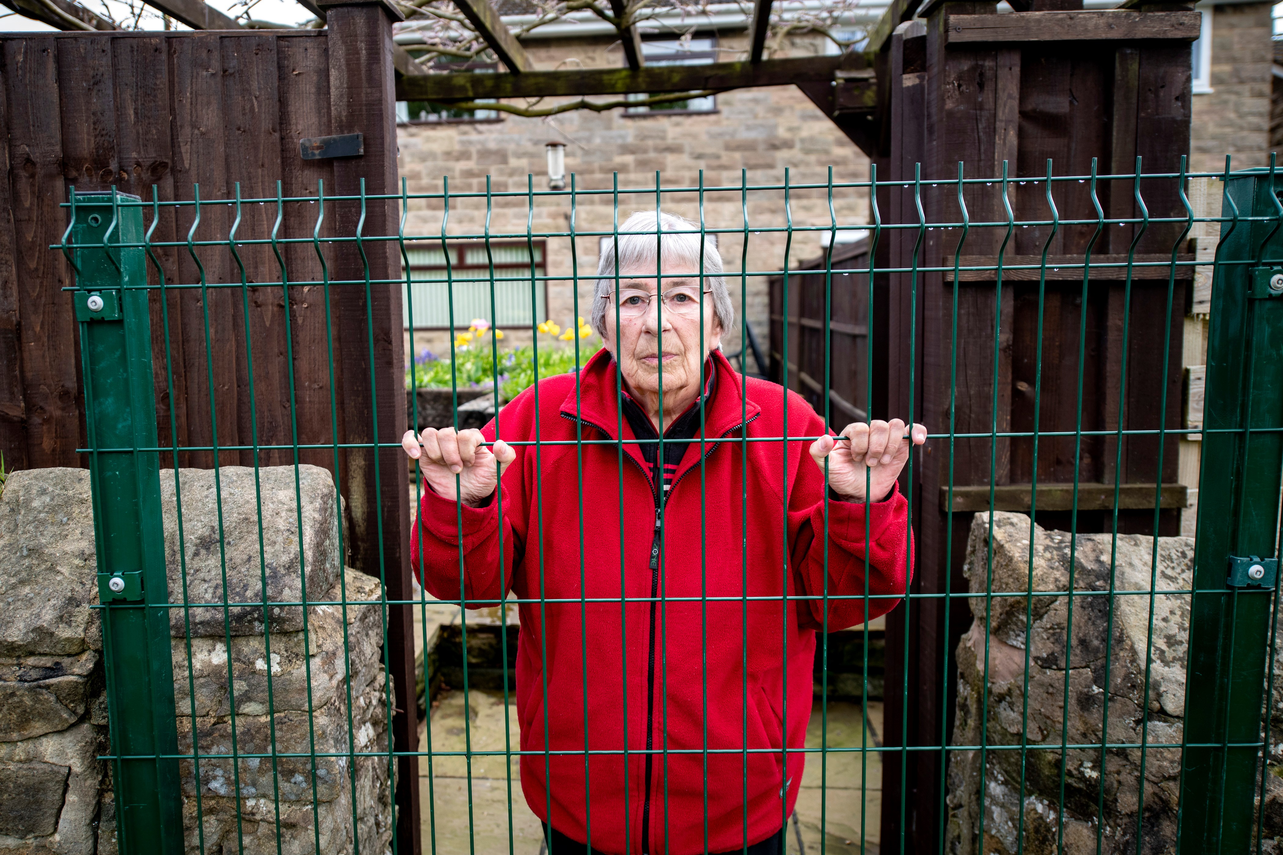 Fenced-in woman, 81, wins three year & £50,000 battle with council over gap in her garden wall