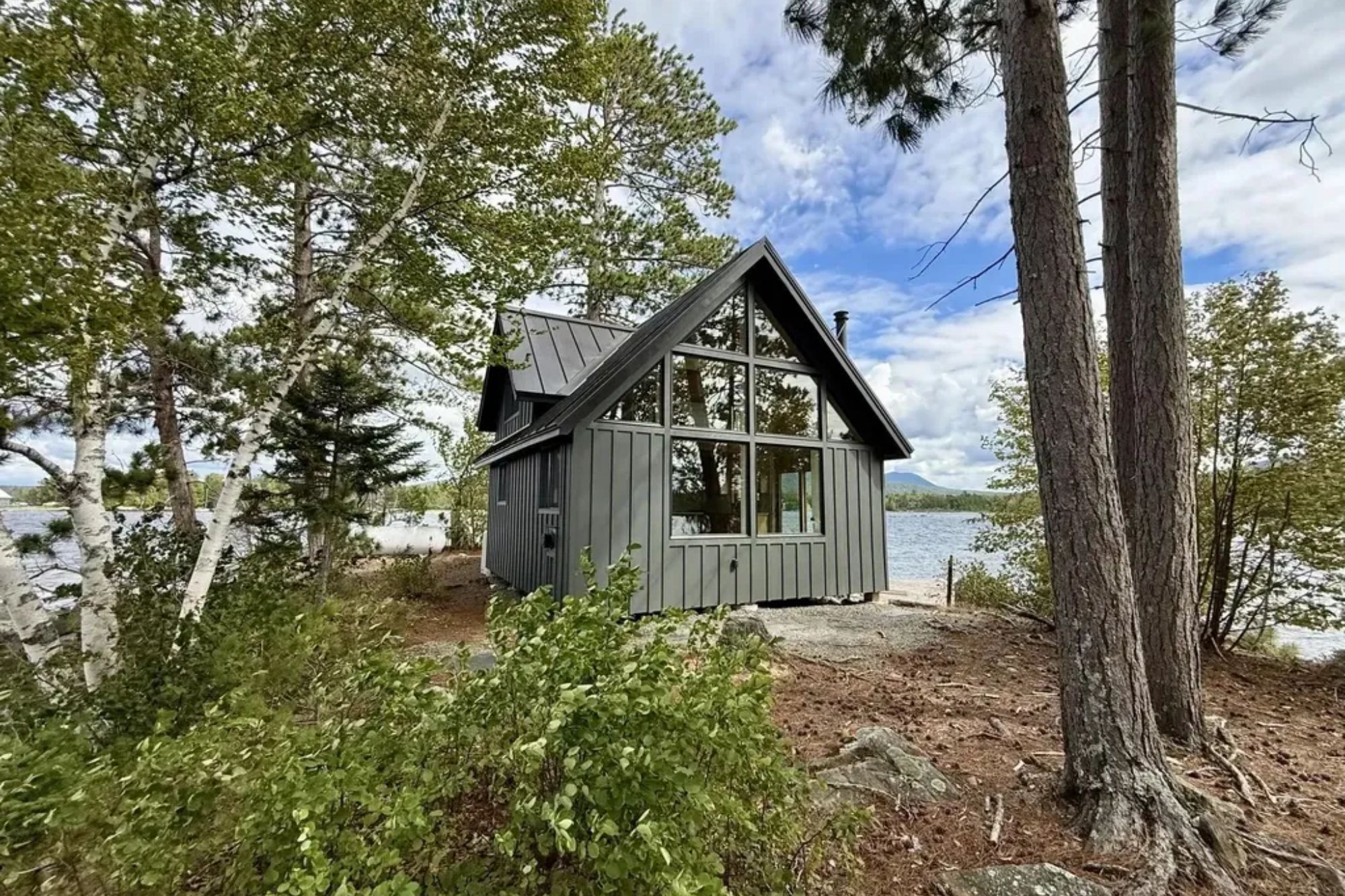 Private island with modern tiny home is selling for $450k – & owner will enjoy ‘end of the Earth’ lake & mountain views