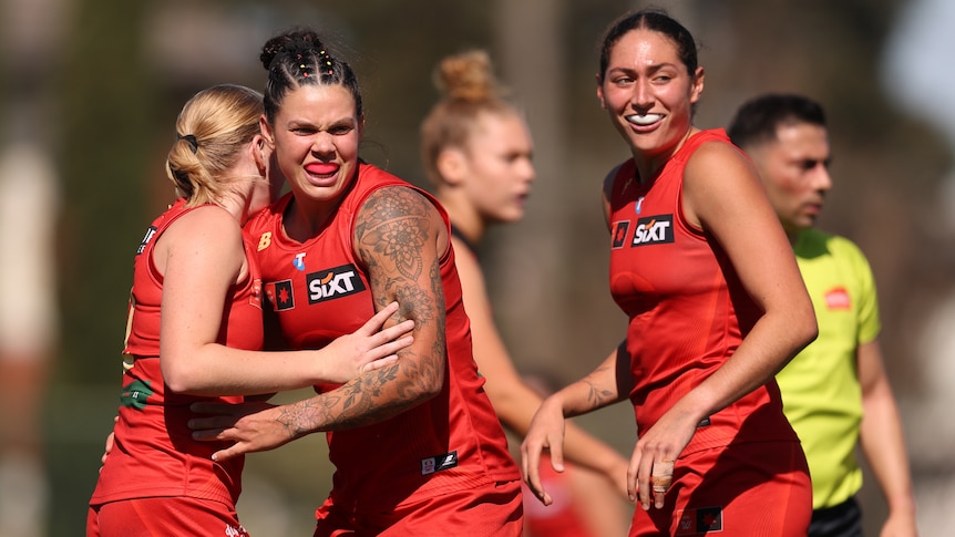 Suns surge to victory, Tigers survive Giants comeback in AFLW