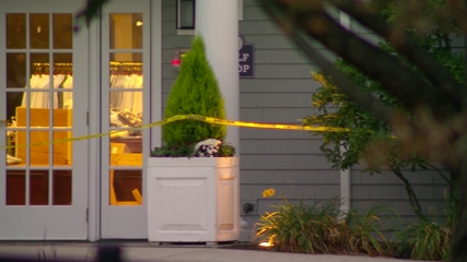Three people hurt after car slams into golf pro shop