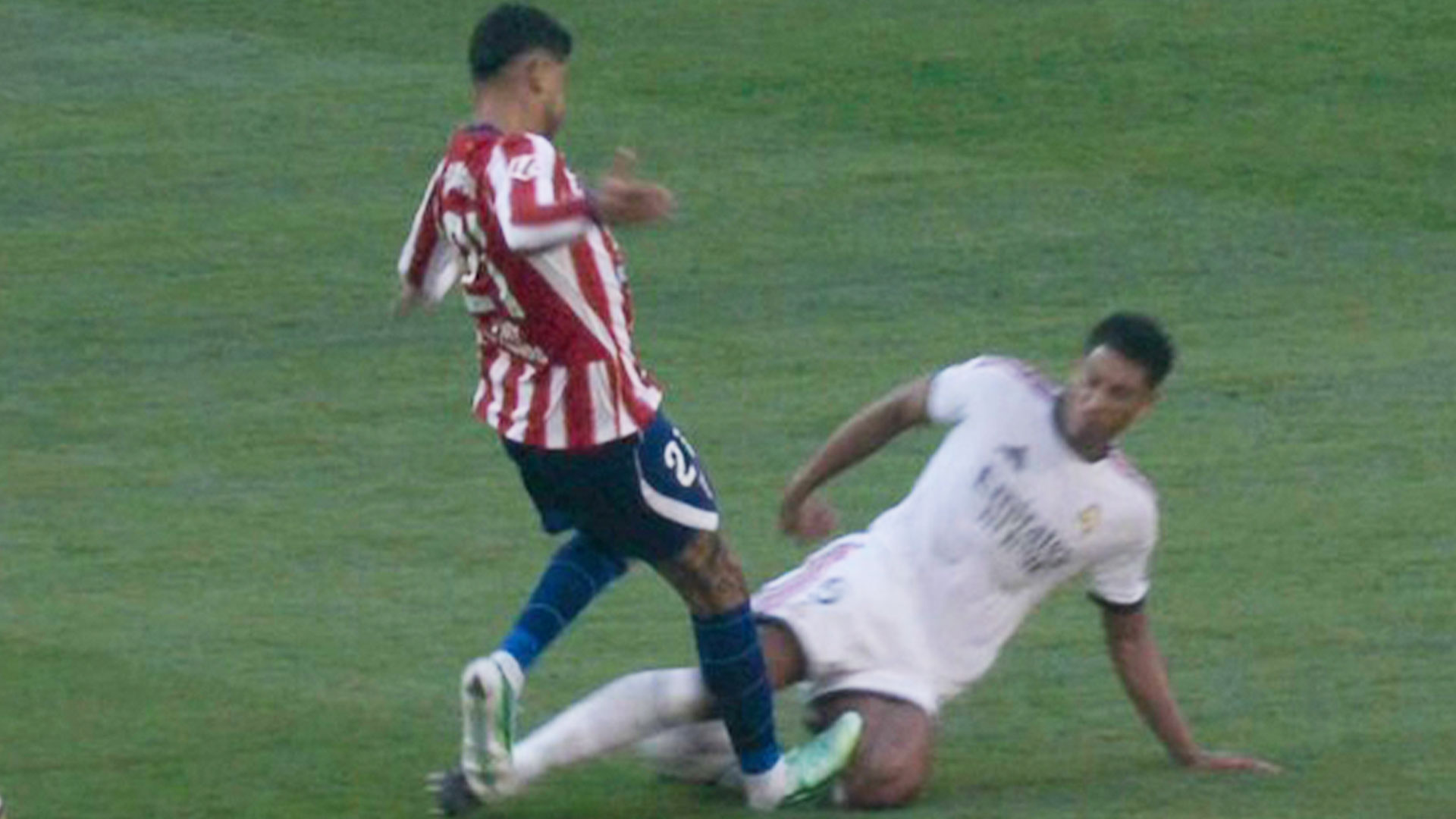 Cristian Romero only given yellow card for studs-up challenge on Bellingham as Atletico vs Real Madrid ref DEFIES VAR